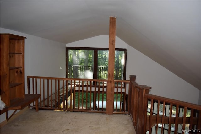 stairway with light carpet and lofted ceiling