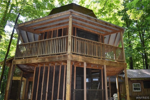 view of home's exterior featuring a balcony