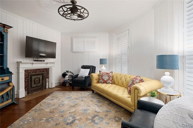 living room featuring dark hardwood / wood-style flooring and ceiling fan