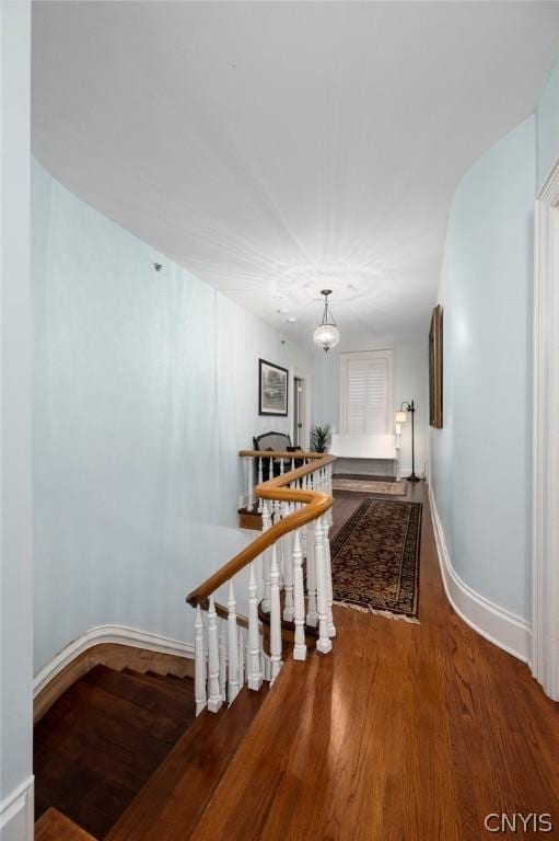 stairway featuring dark hardwood / wood-style flooring