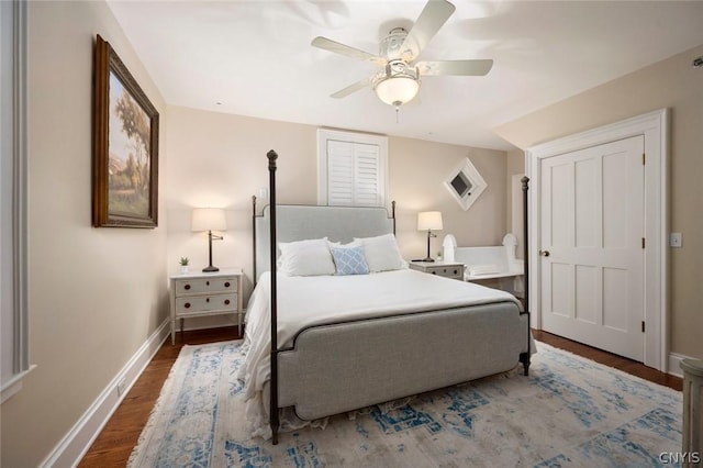 bedroom featuring ceiling fan and dark hardwood / wood-style flooring