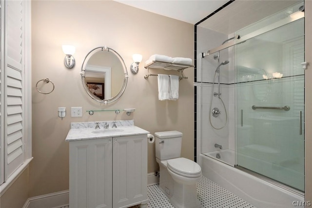 full bathroom featuring tile flooring, shower / bath combination with glass door, toilet, and oversized vanity