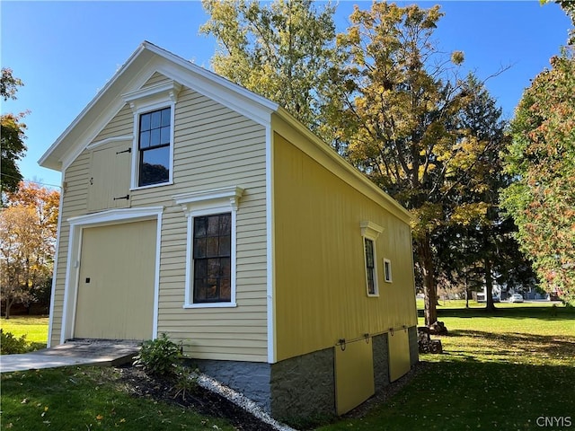 view of property exterior with a yard