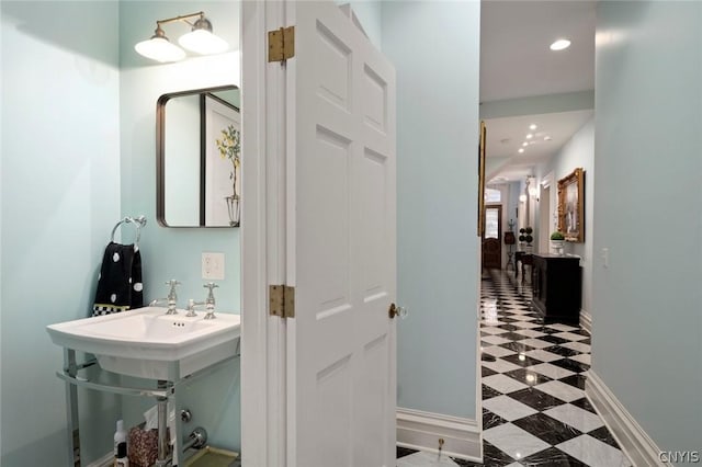 bathroom with tile flooring and vanity with extensive cabinet space