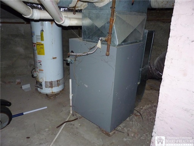 utility room with water heater and heating utilities