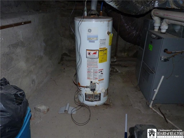 utility room with heating utilities and water heater