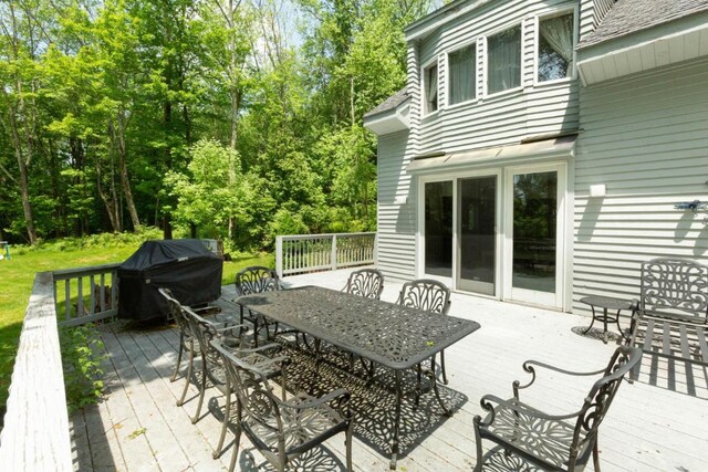 wooden deck featuring grilling area