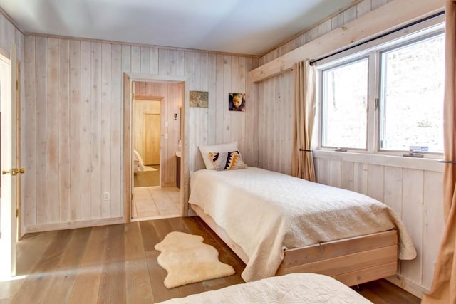 tiled bedroom featuring wooden walls