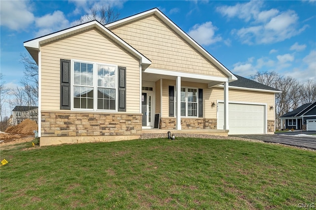 view of front facade with a front yard and a garage