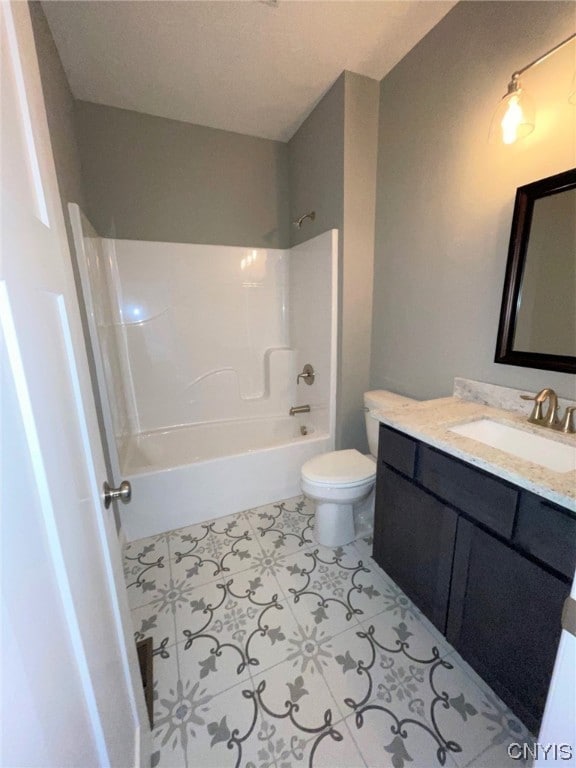 full bathroom with tile flooring, bathing tub / shower combination, toilet, and vanity