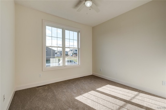 carpeted empty room featuring ceiling fan