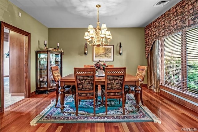 1567 Lake Rd, Porter, NY 14174 - dining space featuring an inviting chandelier and tile floors