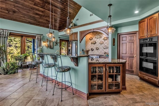 1567 Lake Rd, Porter, NY 14174 - kitchen featuring light tile floors, tasteful backsplash, black double oven, and pendant lighting