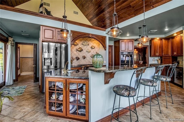 1567 Lake Rd, Porter, NY 14174 - kitchen with light tile floors, wood ceiling, a breakfast bar, a center island with sink, and tasteful backsplash