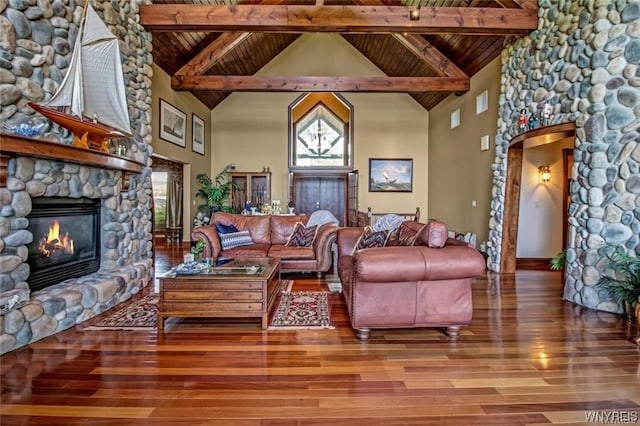 1567 Lake Rd, Porter, NY 14174 - living room with hardwood / wood-style floors, wooden ceiling, a stone fireplace, and beamed ceiling