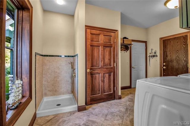 1567 Lake Rd, Porter, NY 14174 - interior space featuring tile flooring, washer / dryer, and a tile shower