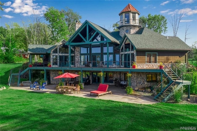 1567 Lake Rd, Porter, NY 14174 - rear view of house with a patio area and a lawn