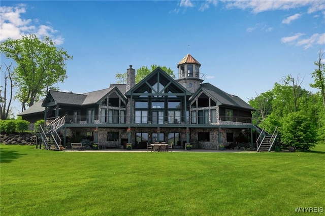 1567 Lake Rd, Porter, NY 14174 - rear view of house with stairway, a lawn, a wooden deck, and a patio