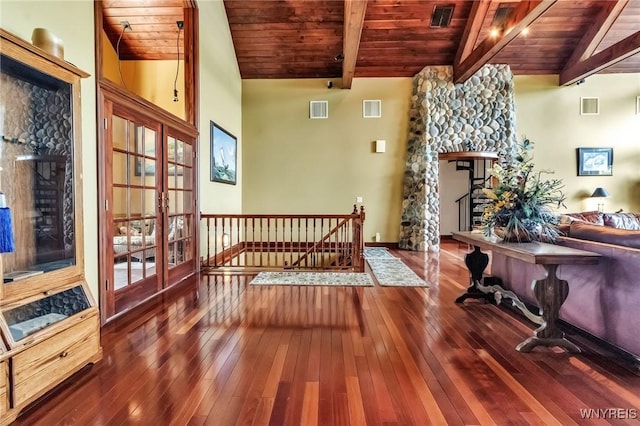1567 Lake Rd, Porter, NY 14174 - living area with wooden ceiling, a stone fireplace, an upstairs landing, wood-type flooring, and french doors