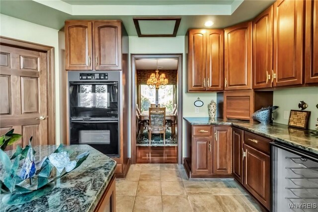 1567 Lake Rd, Porter, NY 14174 - kitchen featuring beverage cooler, dark stone counters, a chandelier, and light tile patterned floors