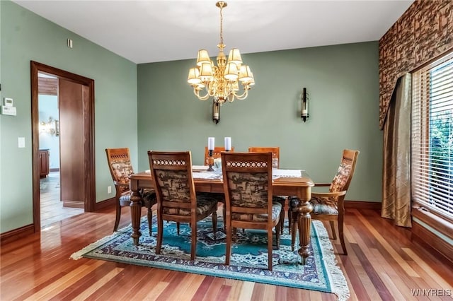 1567 Lake Rd, Porter, NY 14174 - dining room with a chandelier and wood finished floors