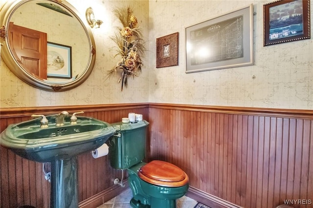 1567 Lake Rd, Porter, NY 14174 - half bathroom with a wainscoted wall and wallpapered walls