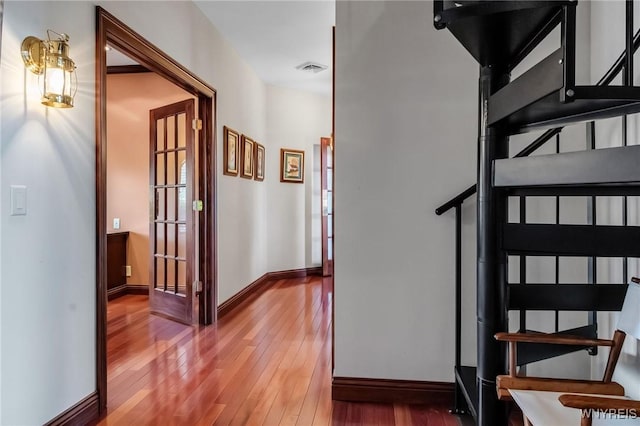 1567 Lake Rd, Porter, NY 14174 - staircase featuring wood-type flooring and baseboards