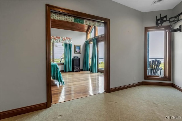 1567 Lake Rd, Porter, NY 14174 - carpeted spare room featuring baseboards
