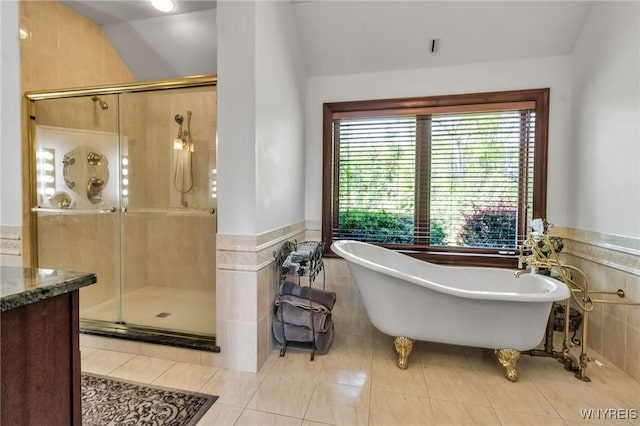 1567 Lake Rd, Porter, NY 14174 - bathroom with tile patterned flooring, a freestanding bath, tile walls, a shower stall, and wainscoting