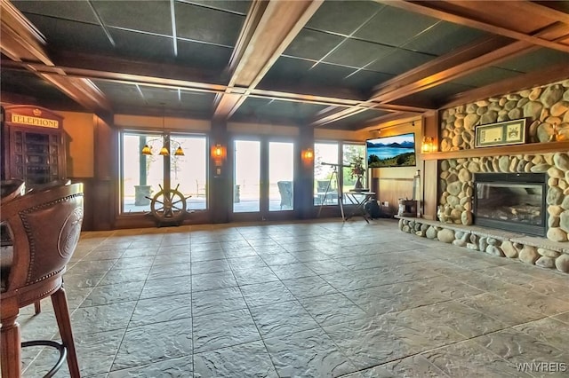 1567 Lake Rd, Porter, NY 14174 - unfurnished living room featuring coffered ceiling, a fireplace, and beamed ceiling