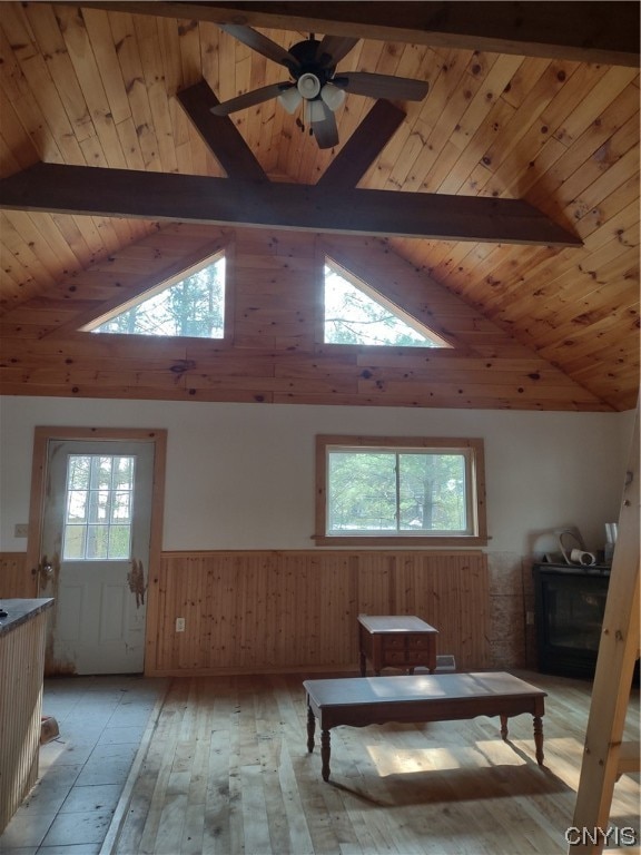 interior space featuring plenty of natural light, wooden ceiling, and beamed ceiling