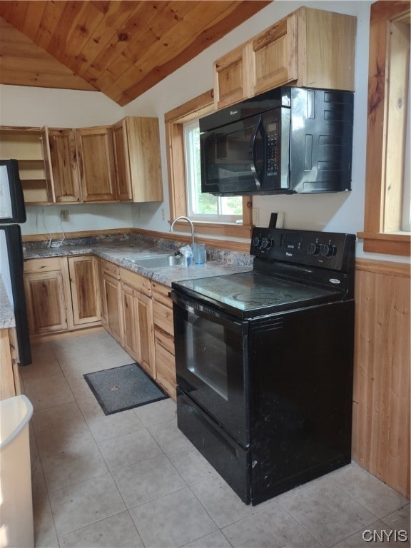 kitchen featuring sink, vaulted ceiling, black appliances, and light tile flooring