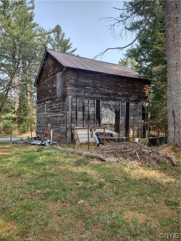 back of house with a yard