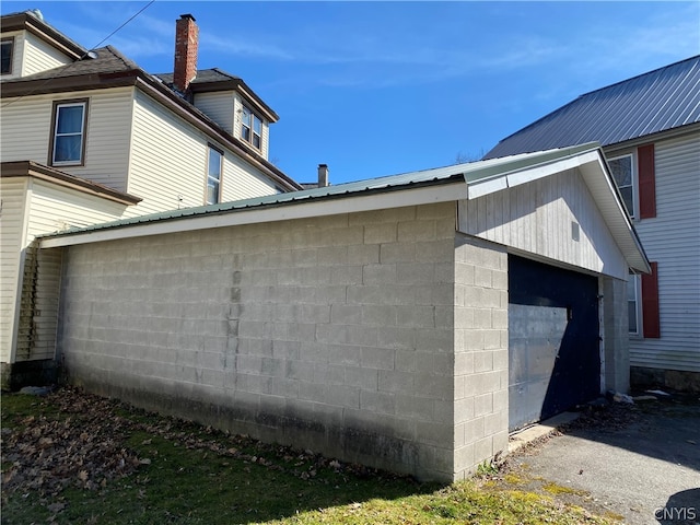 view of property exterior featuring a garage