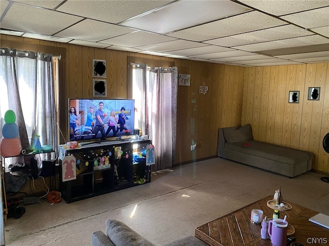 living room with wood walls