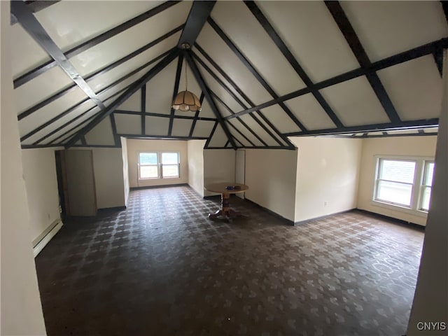 bonus room featuring lofted ceiling with beams and a baseboard radiator