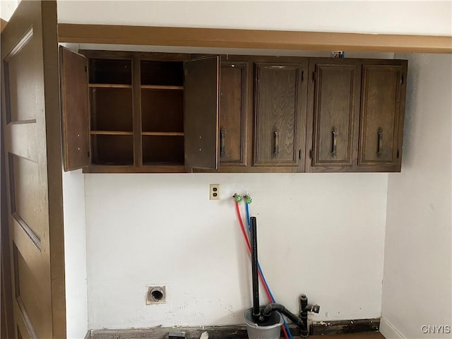 laundry room with hookup for a washing machine, cabinet space, and electric dryer hookup