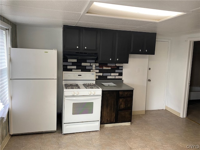 kitchen featuring light tile flooring, tasteful backsplash, white appliances, a paneled ceiling, and ventilation hood