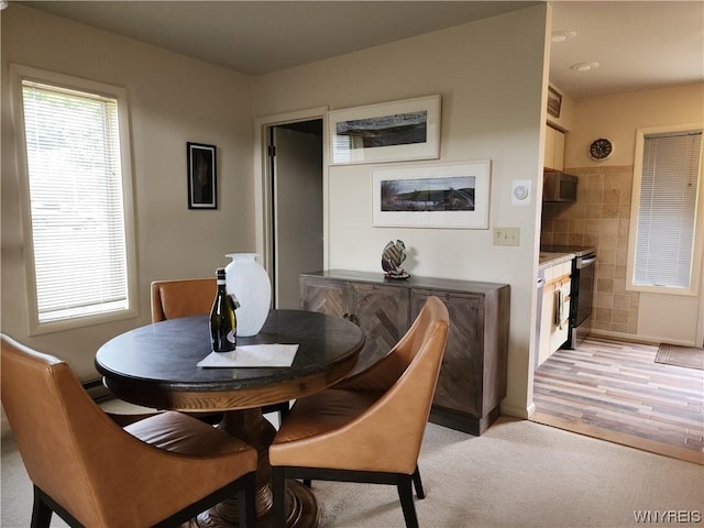 dining area with light wood-type flooring