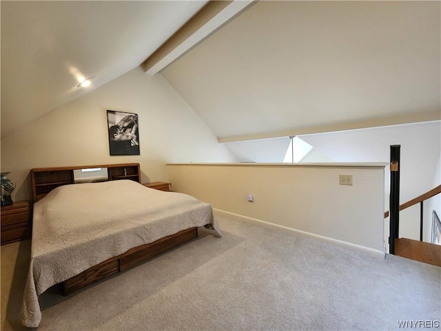 carpeted bedroom with vaulted ceiling with beams