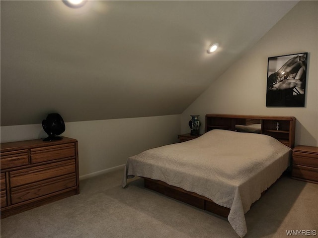 carpeted bedroom featuring vaulted ceiling