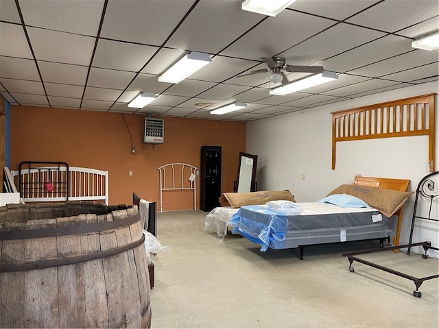 carpeted bedroom featuring a paneled ceiling and ceiling fan