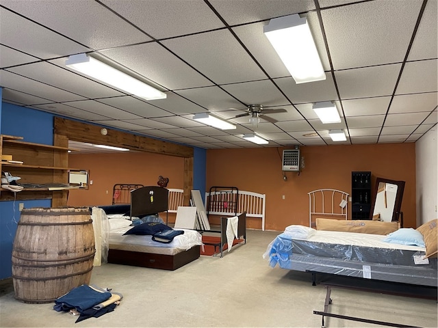 bedroom featuring carpet floors, ceiling fan, and a paneled ceiling