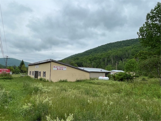 view of side of property with a mountain view