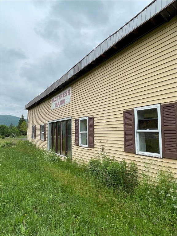 view of home's exterior featuring a lawn