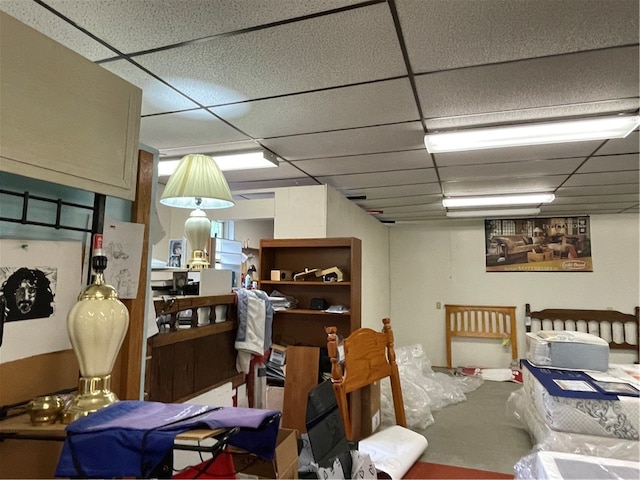 interior space with a paneled ceiling