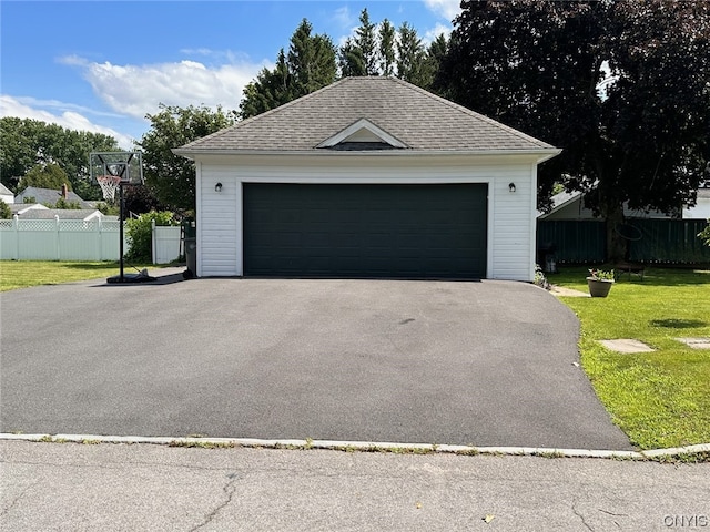 garage with a yard