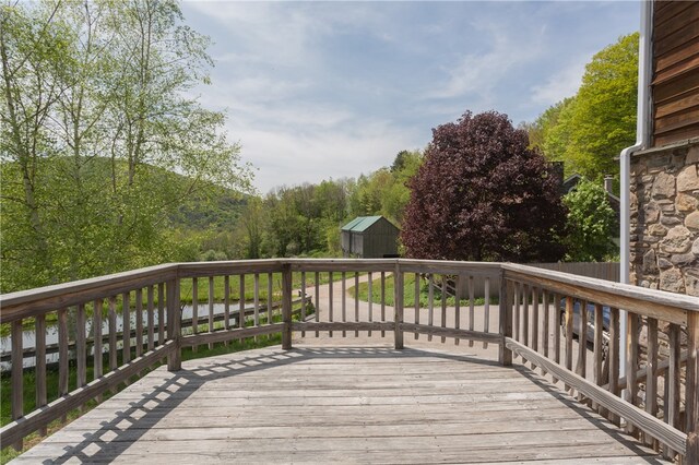 wooden terrace with a storage unit