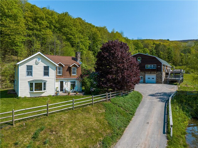 view of front of house featuring a front yard and a garage