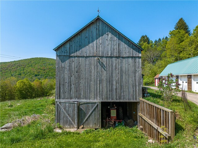 view of outbuilding with a mountain view